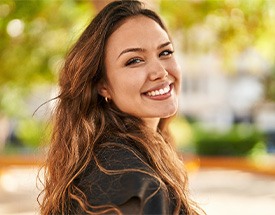 Closeup of woman smiling outside