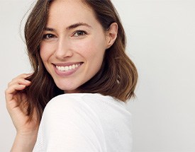 Woman with straight teeth smiling